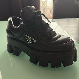 PRADA Monolith Triangle Logo Black Leather Sneakers. Brand new, never been worn.